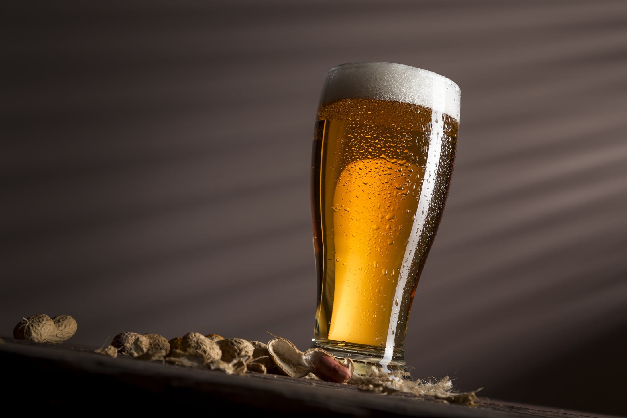 A backlit glass of beer